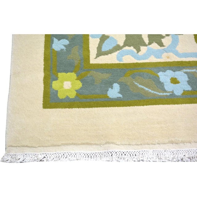 Hand-knotted with care using traditional rug-making techniques, this wool rug blends timeless craftsmanship with a modern...