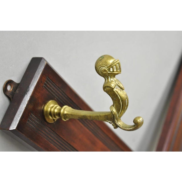 Antique Victorian Mahogany X-Form Wall Coat Rack W/ Brass Knight's Helmet Hooks For Sale In Philadelphia - Image 6 of 14