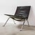 Danish lounge chair designed by poul kjærholm and produced by fritz hansen. executed with a black leather seat mounted on...
