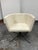Design Plus Gallery presents the Swivel Facetta Chair from CB2. This contemporary accent chair is upholstered in an ivory-...