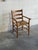 Beautiful vintage Danish armchair crafted in solid pine with handwoven rush seat and classic Scandinavian ladderback...