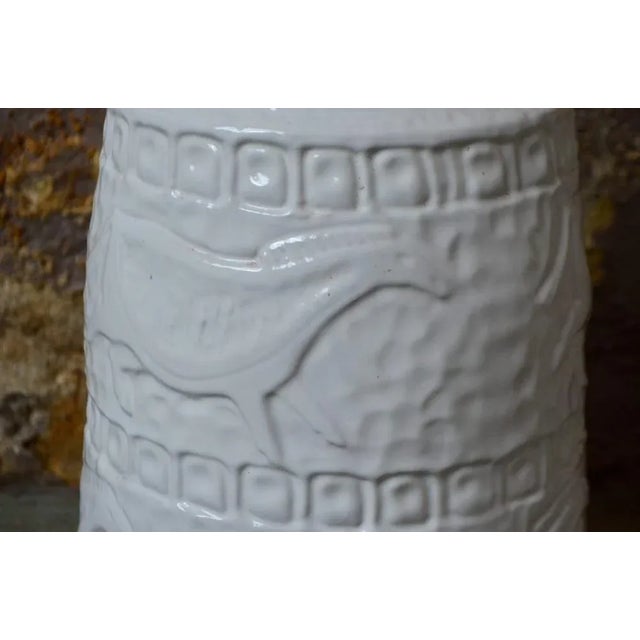 This pretty vase with ivory enamel is signed "Carstens Tonnieshof". It is decorated with stylized horses in a rock style....