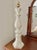A versatile tall porcelain lamp in a pillar shape stacked atop a shapely base. Stately in stature. 25.75" to the top of...