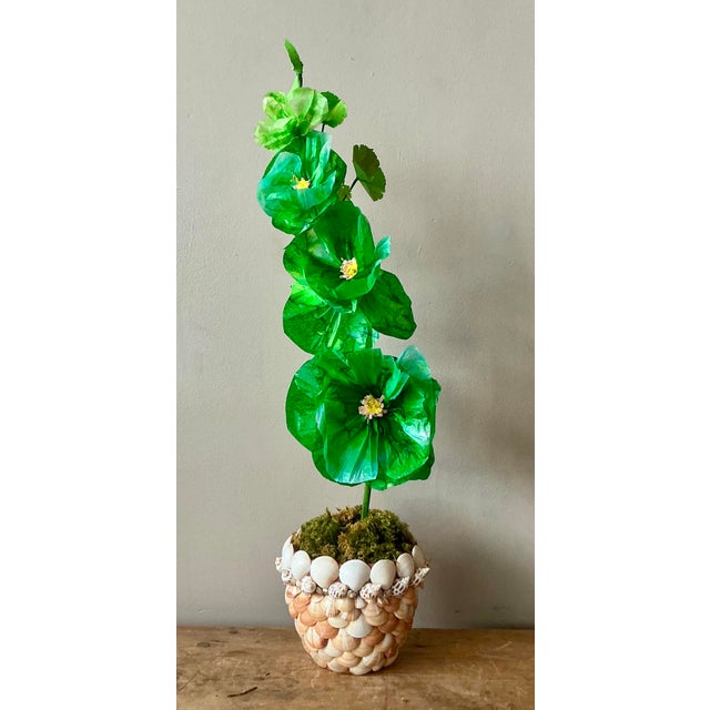 Contemporary hand-rolled paper flowers are a modern, artistic take on traditional floral arrangements. These flowers are...