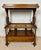 Elegant Victorian walnut Canterbury featuring a removable tray top, open slatted storage compartment, and a lower drawer....