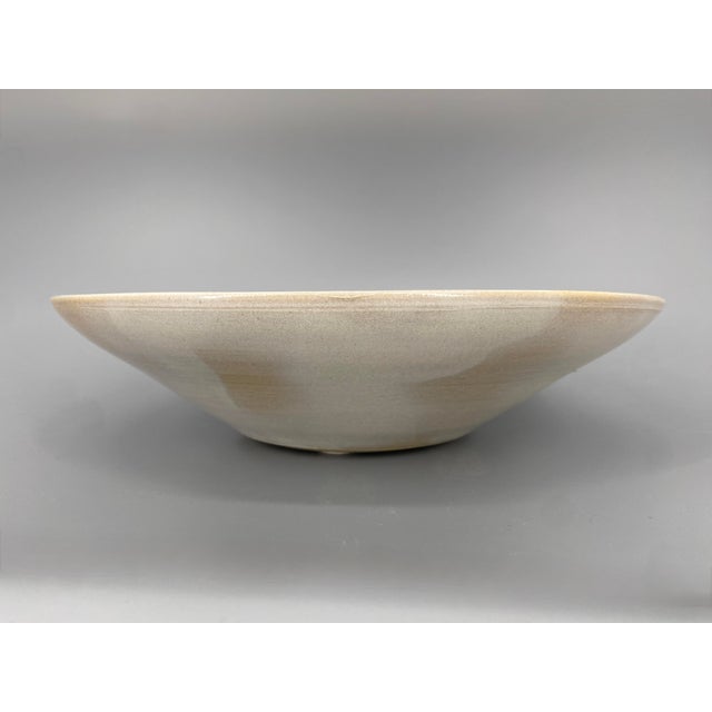 A bowl * Shallow bowl/fruit bowl * Studio ceramic attributed to Richard Bampi (1896–1965) * Light-colored earthenware with...