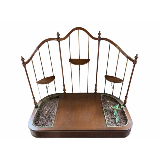 This unique vintage-style console table features an ornate, multi-tiered arched frame with delicate spindles and three...