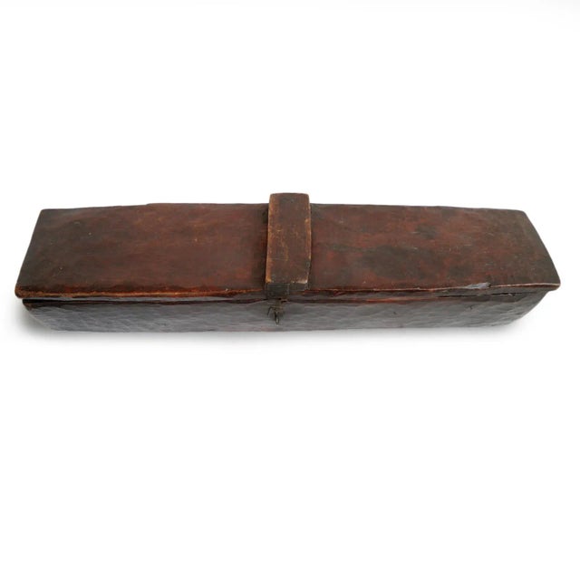 Old Ethiopian carved wood tribal storage box. Bottom carved of a single piece of wood with hedged wood. Used to store...