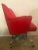 This is a leather and aluminium office tilting armchair.