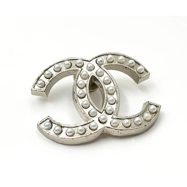 This is part of Chairish’s Costume Jewelry assortment. Chanel Silver CC Crystal Large Pin * Marked 03 * Made in France -It...