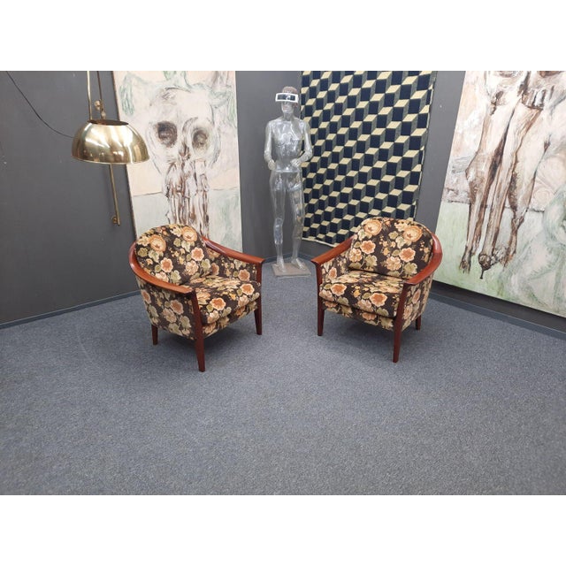 Spring and summer can come! Two cheerful armchairs by Wilhelm Knoll. Made in the 1970s. The flower power fabric upholstery...