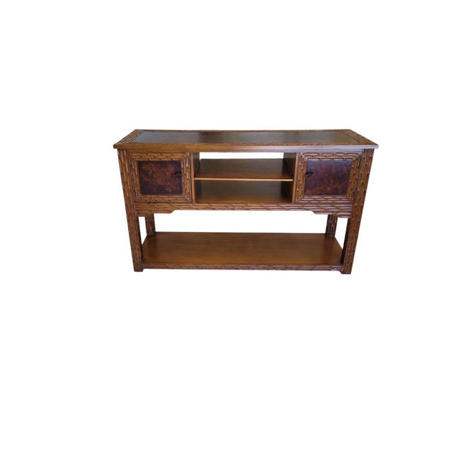 A distinctive late-20th-century Spanish Revival console credenza, blending rustic Iberian craftsmanship with refined...