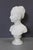 Bust of a young woman on a rotating base, depicting Marie Louise Brongniart after Houdon in white Carrara marble, height...