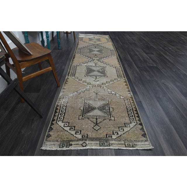Vintage Hand-Knotted area rug is a semi-antique vintage area rug. The '70s Eastern region of Anatolia's unique rug is...