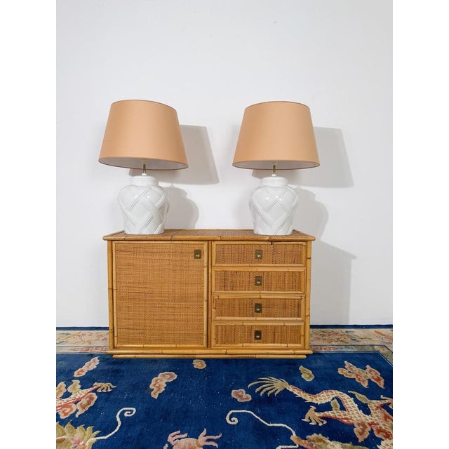 We are pleased to offer this elegant Italian Mid-Century cabinet, handcrafted in bamboo, rattan, and cane by the renowned...