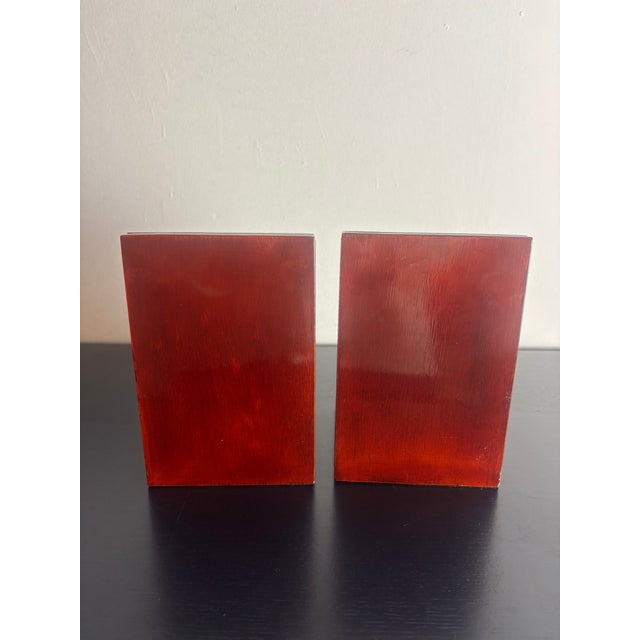 Charming pair of vintage brass teddy bear bookends mounted on red wood stained bases. Substantial and decorative, very...