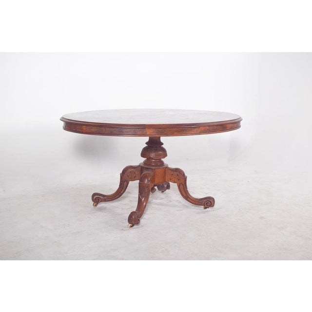Oval walnut table with tilt-top. Classically elegant and handmade, the top is oval and finished in polished walnut,...