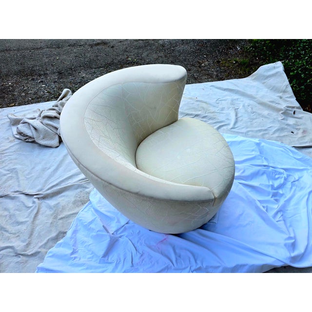 This striking Weiman Nautilus swivel chair is a masterclass in Mid-Century Modern sculptural design. Influenced by the...