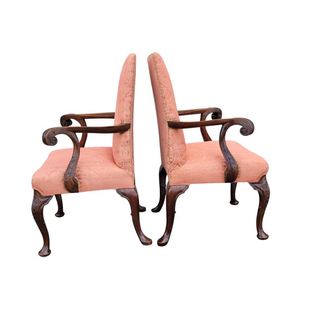 Pair of 19th Century Queen Anne armchairs crafted from solid walnut with fine carved details and original finish. Each...