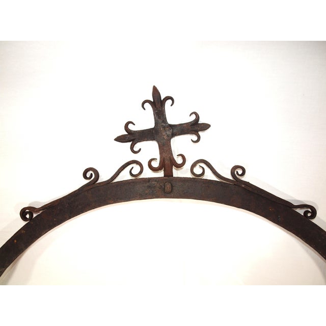 1700’s hand forged Iron arch. Arch has scrollwork on top along with a cross in the missile. Arch was attached to two brick...