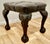 A 19th century carved walnut leather chesterfield library stool. The stool is upholstered in deeply buttoned brown leather...