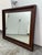 Design Plus Gallery presents a Cherry Wood Wall Mirror from Omexey Home Furnishings. The rectangular mirror has a broad...