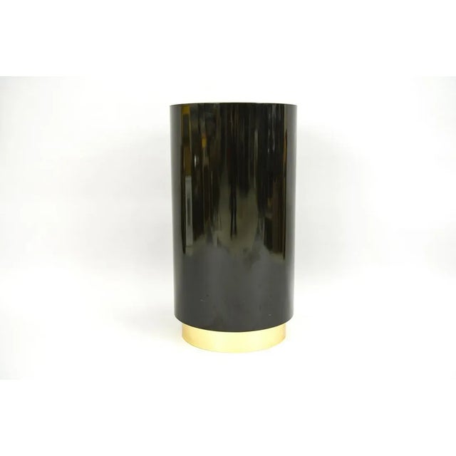 Vintage round black laminate pedestal with recessed brass base. Perfect for displaying sculpture, photo, plants, etc.
