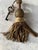 An antique French gold metallic tassel. often used to accent furniture knobs, drapery, or as a decorative fob for a...