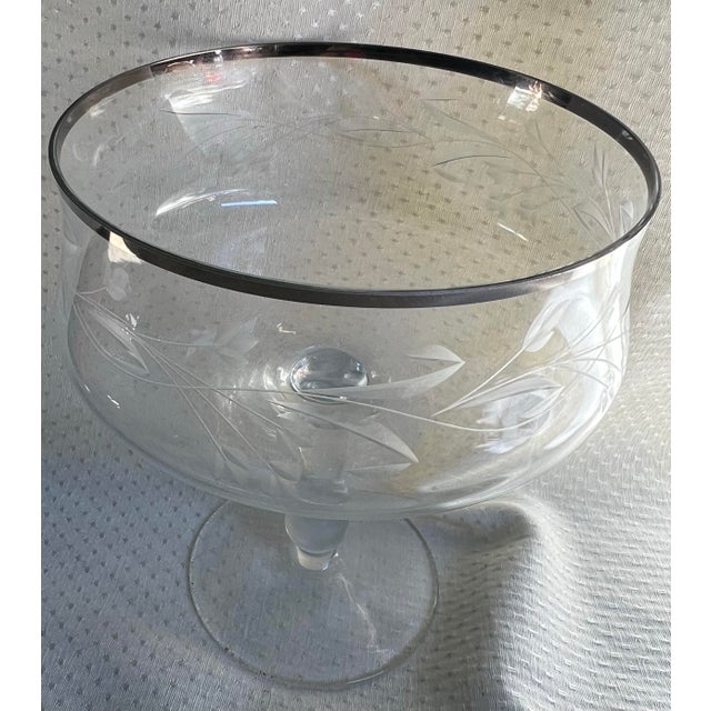 Up for consideration is a beautiful vintage Dorothy Draper chrome rimmed etched champagne glass. This would look lovely on...