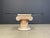 Elegant tesselated stone coffee table pedestal base with a square clear glass top. The coffee table has a lot of cool...