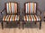 A pair of late 18th C. Italian carved walnut armchairs, the arched crest rails centered by carved flowerheads, with shaped...