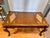 An elegant traditional executive writing desk featuring a genuine leather writing surface accented with real marble inlays...
