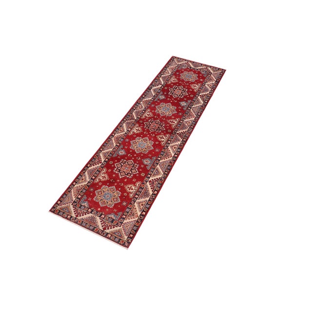 Enhance your home with this exquisite hand-knotted Kazak rug, crafted from fine hand-spun wool and dyed with all-natural...