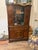 Beautiful vintage display cabinet crafted in richly finished wood with elegant carved detailing throughout. This piece...