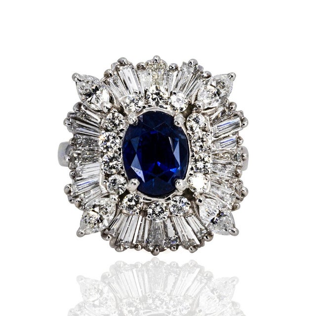 Platinum ring with fine sapphire weighing 2.61 carats and approximately 4.16 carats or round and baguette cut diamonds....