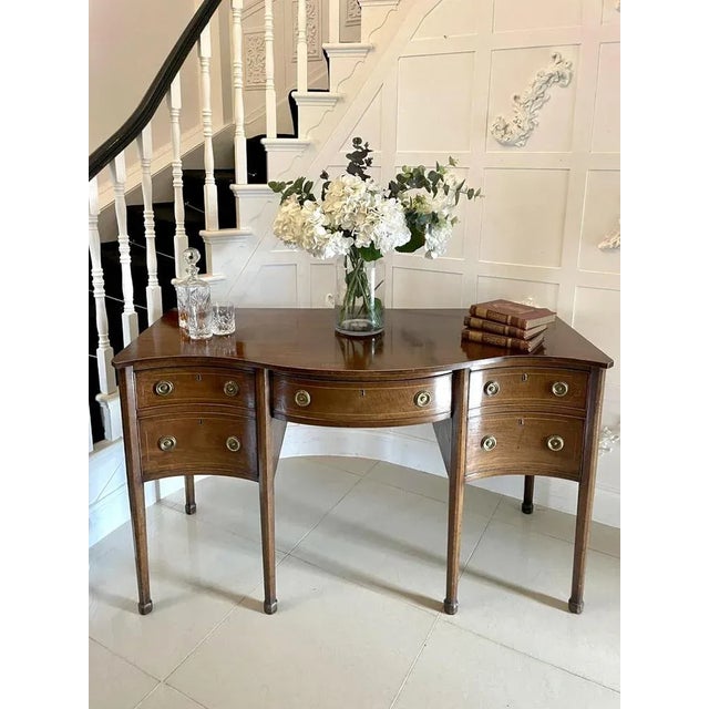 Unusual Antique George III quality mahogany serpentine shaped sideboard having a quality serpentine shaped mahogany top...