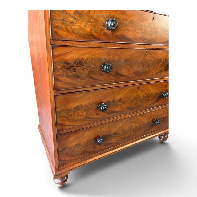 An antique 19th century Chest of 6 Drawers/ Dresser. Exceptional flame mahogany veneers to the drawer fronts. Original...