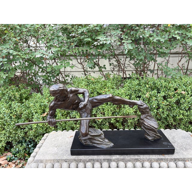 French Art Deco Bronze Sculpture. Beautifully executed French Art Deco bronze sculpture of an athlete on a black marble...