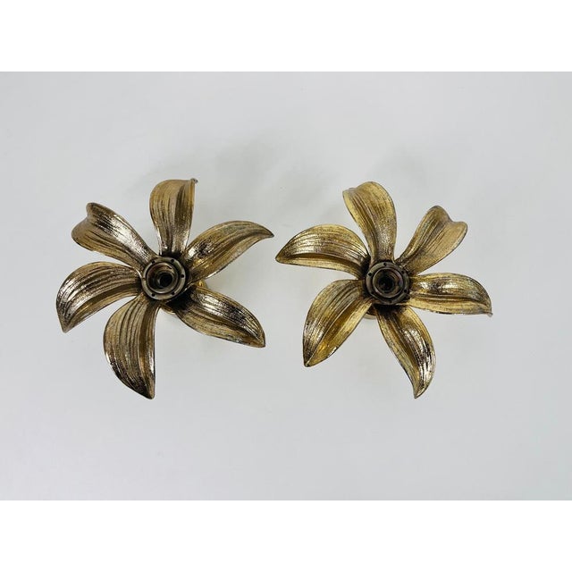 A set of brass flushmounts by willy daro for massive made in belgium in the 1960s. The lamp has a beautiful wheat sheaf...