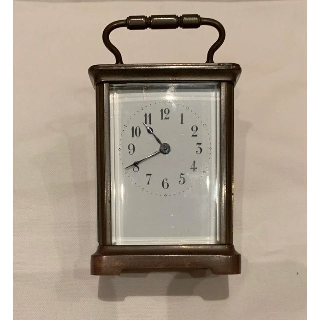 Traditional English Vintage Brass Carriage Clock with glass front, sides and back. Includes brass winding key.