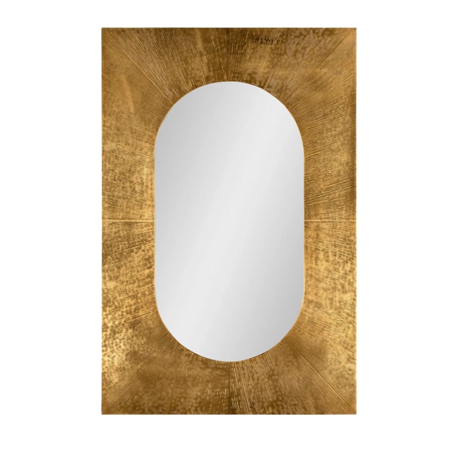 Brass cladded metal frame with clear mirror Assembly Required? No Care Instructions: Dust with a soft, clean cloth...