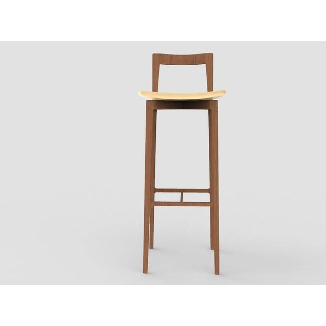 with its light and solid wood structure, this chair is suitable for contemporary interiors. Its proportions and reduced...