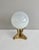Handblown opaque white orb sitting on a midcentury brass base featuring three koi fish. Thank you for shopping my Chairish...