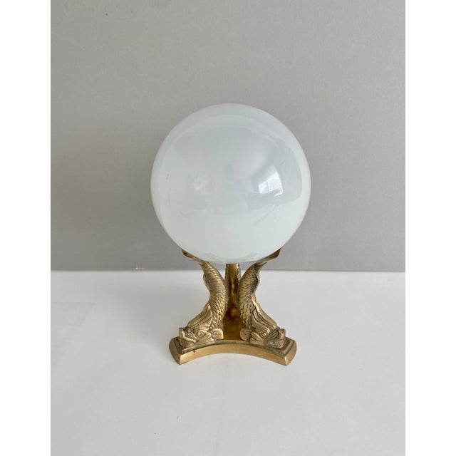 Handblown opaque white orb sitting on a midcentury brass base featuring three koi fish. Thank you for shopping my Chairish...