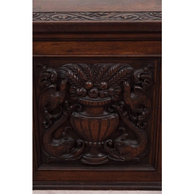 Highly carved Black Forest large wood box. Carvings include dolphins, urns, flowers, and foliage. Made in the 1940s,...