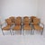 The chairs feature beautifully woven wicker seats and backs, set within a strong and sculptural black iron frame. The...