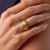 This bold vintage engagement ring showcases a striking 2.43 carat round brilliant cut diamond, certified by GIA...