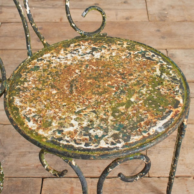 Antique Iron French Decorative Garden Chair A beautiful French black/green/white iron garden armchair. It has a decorative...