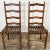Vintage pair of ladderback dining or occasional chairs with slatted seats. Rich natural finish and classic shape. Unique...