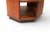 Architectural octagonal end, or side table having a walnut structure with an interior shelf, and recessed black plinth...